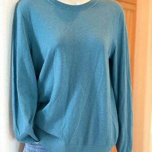 100% Wool. Beautiful light Teal Crew Neck Sweater